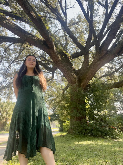 Sarah standing under a tree